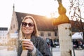 Portrait young beautiful happy smiling woman drinking coffee to go tea in eco sustainable paper cup wear wool coat enjoy Royalty Free Stock Photo