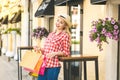 Portrait of young happy smiling woman with shopping bags Royalty Free Stock Photo