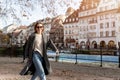 Portrait young beautiful happy smiling woman wear wool tweed coat enjoy walking Ill river embankment european Strasbourg