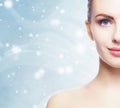 Portrait of young, beautiful and healthy woman: over winter background. Healthcare, spa, makeup and face lifting concept Royalty Free Stock Photo