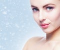 Portrait of young, beautiful and healthy woman: over winter background. Healthcare, spa, makeup and face lifting concept Royalty Free Stock Photo