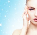 Portrait of young, beautiful and healthy woman: over winter background. Healthcare, spa, makeup and face lifting concept Royalty Free Stock Photo