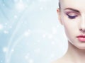 Portrait of young, beautiful and healthy woman: over winter background. Healthcare, spa, makeup and face lifting concept Royalty Free Stock Photo