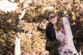 Portrait of young beautiful interracial newlyweds on a walk Royalty Free Stock Photo