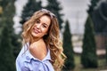 Portrait of a young beautiful laughing woman with brown hair and brown eyes. Royalty Free Stock Photo