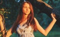 Portrait of young beautiful long-haired redhaired woman in apple orchard Royalty Free Stock Photo