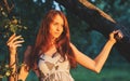 Portrait of young beautiful long-haired redhaired woman in apple orchard Royalty Free Stock Photo