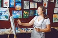 Caucasian woman artist drawing painting in art studio Royalty Free Stock Photo