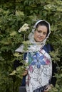 Portrait of A Young Beautiful Muslim Girl in Front of Flourished