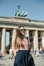 Portrait of a young beautiful positive smiling stylish tourist girl.