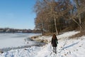 Portrait of a young beautiful red hair european girl walking near the frozen river Royalty Free Stock Photo