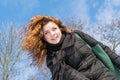 Portrait of a young beautiful red hair smiling european girl at winter season