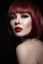 Young beautiful red-haired girl with bob haircut and Royalty Free Stock Photo