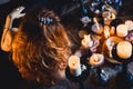 Portrait of young beautiful red-haired girl in the image of a Gothic witch on Halloween Royalty Free Stock Photo