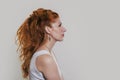 Portrait of a young beautiful red-haired woman  in gentle colors Royalty Free Stock Photo