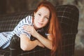 Portrait of young beautiful redhead woman relaxing at home in the autumn Royalty Free Stock Photo