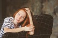 Portrait of young beautiful redhead woman relaxing at home in the autumn Royalty Free Stock Photo