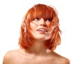 Portrait of young beautiful redheaded woman looking up into the
