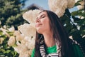 Portrait of young beautiful relaxed woman closed eyes enjoy vacation weekend outdoors breathing smell flavor natural Royalty Free Stock Photo