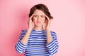 Portrait of young beautiful sad stressed unhappy unwell sick ill girl has headache isolated on pink color background Royalty Free Stock Photo