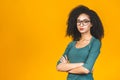 Portrait of beautiful serious african american curly woman standing with arms crossed Royalty Free Stock Photo