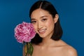 Portrait of young beautiful smiling asian woman with pink flower Royalty Free Stock Photo
