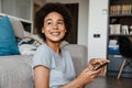 Portrait of young beautiful smiling curly african woman with phone Royalty Free Stock Photo
