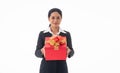Portrait young beautiful smiling happy woman wear black suit  holding red gift box looking at camera on isolated white background Royalty Free Stock Photo