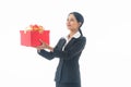 Portrait young beautiful smiling happy woman wear black suit  holding red gift box looking at camera on isolated white background Royalty Free Stock Photo