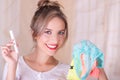 Portrait of young beautiful smiling woman holding a menstruation cotton tampon in one hand and with her other hand an Royalty Free Stock Photo