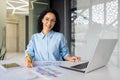 Portrait of young and successful financial accountant at workplace inside office, business woman smiling and Royalty Free Stock Photo