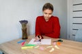 Portrait of young beautiful thoughtful lady writing down her dreams list Royalty Free Stock Photo