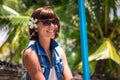 Portrait Young beautiful tropical woman on summer vacation in asia, Bali. Relaxing on tropical beach, sea landscape and Royalty Free Stock Photo