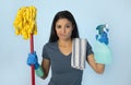 Unhappy and frustrated housekeeping woman holding mop and wash s