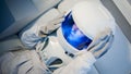 Portrait of a young beautiful woman astronaut, close-up.