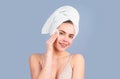 Portrait of young beautiful woman after bath. Beauty face of a cheerful attractive girl with towel on head, isolated Royalty Free Stock Photo