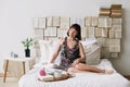 Portrait of a young beautiful woman in bed at home. Beautiful young brunette in the bedroom. Good morning. Lifestyle. Royalty Free Stock Photo