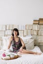 Portrait of a young beautiful woman in bed at home. Beautiful young brunette in the bedroom. Good morning. Lifestyle. Royalty Free Stock Photo