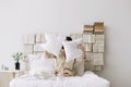 Portrait of a young beautiful woman in bed at home. Beautiful young brunette in the bedroom. Good morning. Lifestyle. Royalty Free Stock Photo