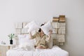 Portrait of a young beautiful woman in bed at home. Beautiful young brunette in the bedroom. Good morning. Lifestyle. Royalty Free Stock Photo