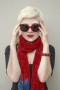 Woman blonde in red scarf, sunglasses. Fashion haircut, accessories. Royalty Free Stock Photo