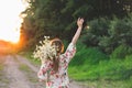 Portrait young beautiful woman with chamomile flowers at sunset. Royalty Free Stock Photo