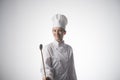 Portrait of a young beautiful woman in cook clothes Royalty Free Stock Photo