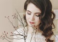 Portrait of a young beautiful woman with dark hair close-up. Bride in elegant classic wedding dress. Morning of the bride. Royalty Free Stock Photo