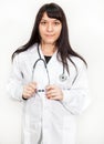 Portrait of young beautiful woman doctor or intern against white background Royalty Free Stock Photo