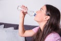 Portrait of a young beautiful woman drinking water out of the bo Royalty Free Stock Photo