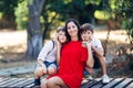 Portrait of a young beautiful woman with her son and nephew.