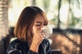 Young woman reads and listens to music Royalty Free Stock Photo