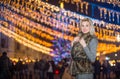 Portrait of young beautiful woman with long fair hair outdoor in cold winter evening. Beautiful blonde girl in winter clothes Royalty Free Stock Photo