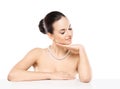 Portrait of a young and beautiful woman in a pearl necklace Royalty Free Stock Photo